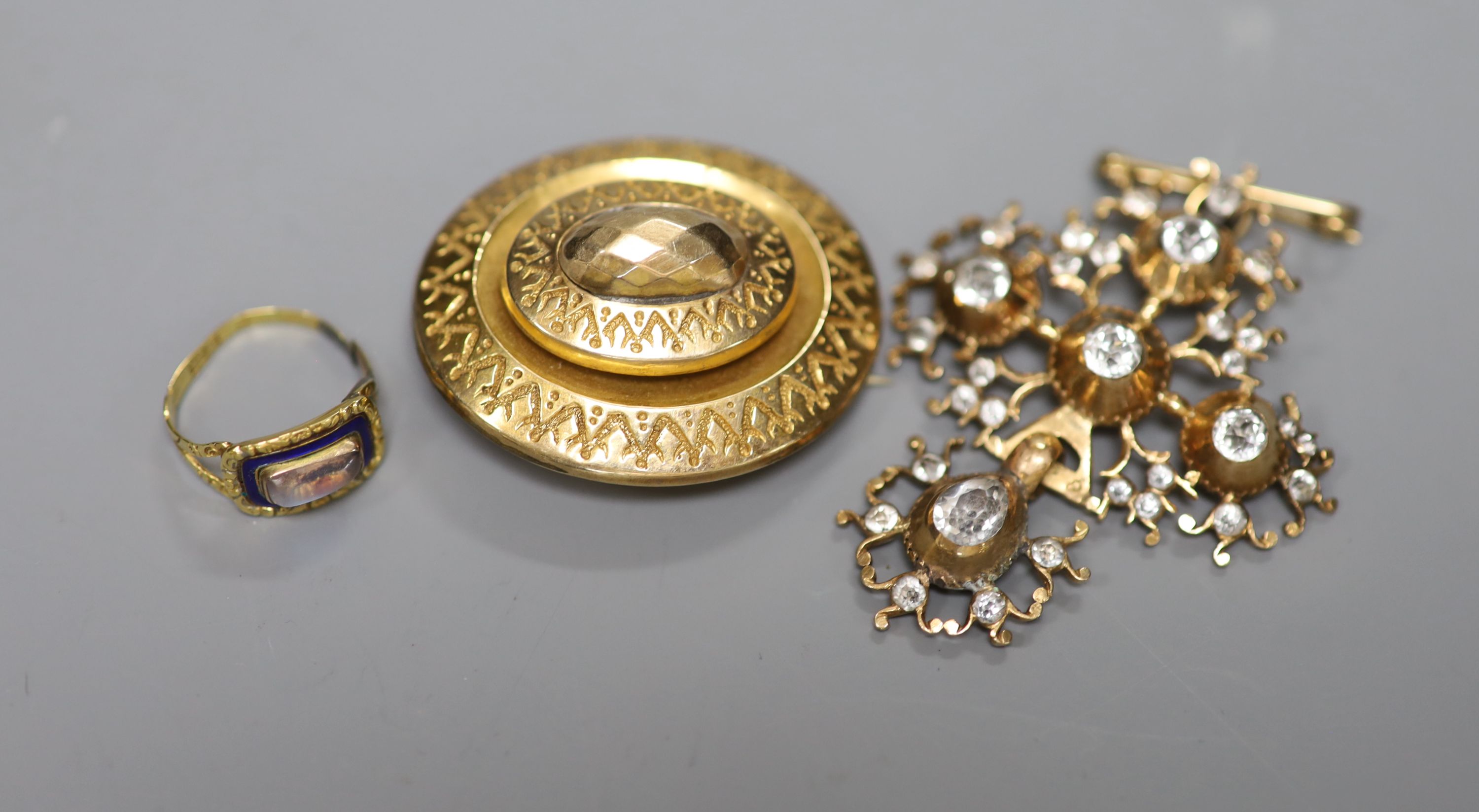 A Georgian yellow metal, enamel and moonstone set mourning ring, pendant and brooch